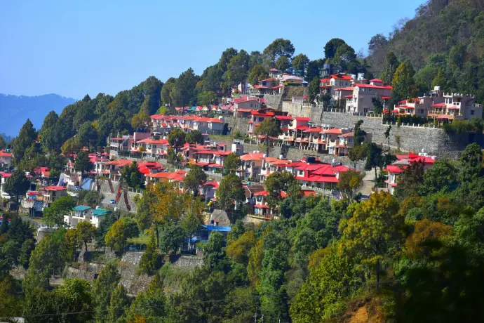 a hillside covered in lots of red roofed houses